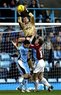 Images Dated 12th February 2005: Luke Steele: Coventry City Goalkeeper Faces Intense Pressure from Burnley's Ian Moore (12-02-2005)