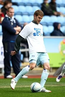 Images Dated 7th April 2012: Martin Cranie Faces Off Against Peterborough United at Ricoh Arena (Npower Championship, 07-04-2012)