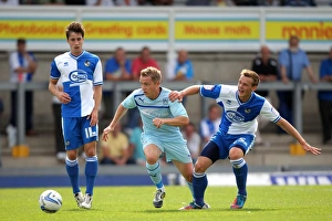Images Dated 2012 August: McSheffrey vs. Clucas: A Battle for the Ball in Coventry City's Pre-Season Clash with Bristol Rovers