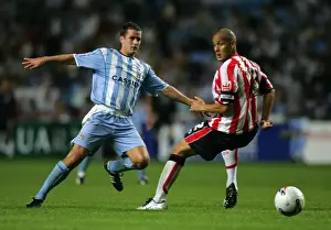 Images Dated 2005: Michael Doyle of Coventry City Outwits Nigel Quashie with a Clever Pass (2005)