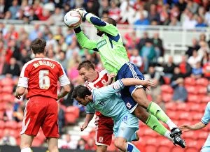Images Dated 27th August 2011: Middlesbrough vs Coventry City: Carl Ikeme Saves Roy O'Donovan's Header in Championship Clash at