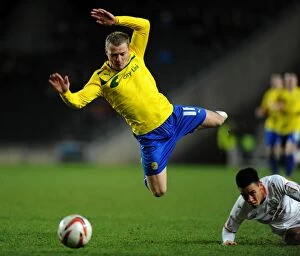 Images Dated 29th December 2012: Milton Keynes Dons vs Coventry City: Aerial Tackle Showdown at StadiumMK