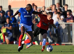 Images Dated 2015 July: Nigel Atangana vs. James Maddison: A Fight for Supremacy in Portsmouth's Pre-Season Clash with Coventry City