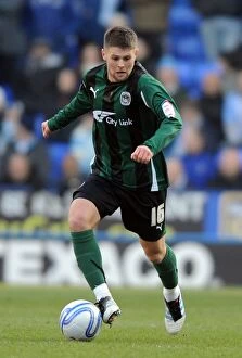 Images Dated 11th February 2012: Oliver Norwood: Coventry City vs. Reading, 2012 - Thrilling Action at Madejski Stadium