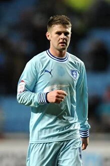 Images Dated 14th February 2012: Oliver Norwood vs Leeds United: Intense Face-Off in Coventry City's Championship Clash (14-02-2012)