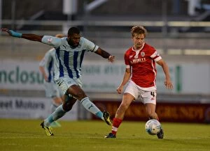 Sky Bet League One - Coventry City v Barnsley - Sixfields Stadium Collection: Reda Johnson vs. Luke Berry: Intense Tackle in Sky Bet League One Match