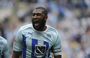 Images Dated 13th September 2014: Reda Johnson's Euphoric Goal Celebration: Coventry City's Victory over Yeovil Town