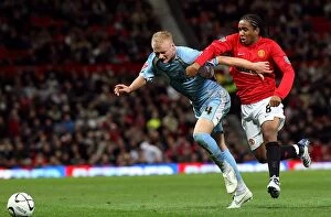 26-09-2007 Carling Cup Round 3 v Manchester United Collection: Robbie Simpson vs. Oliveira Anderson: Intense Battle for the Ball in Coventry City's Carling Cup
