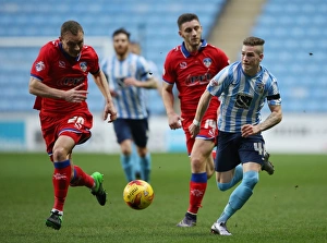 Images Dated 2015 December: Ryan Kent vs. Brian Wilson: Clash of the Titans in Coventry City vs