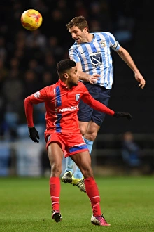 Images Dated 2015: Sam Ricketts Outjumps Dominic Samuel: Coventry City's Aerial Victory vs Gillingham (Sky Bet League One)