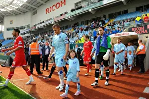 Images Dated 2011 September: Sammy Clingan Kicks Off Coventry City's Championship Match Against Reading (24-09-2011)