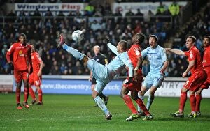 Images Dated 5th February 2013: Showdown at Alexandra Stadium: Leon Clarke vs Abdul Osman - Coventry City vs Crewe Alexandra