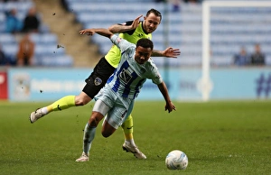 Showdown at Ricoh Arena: A League One Battle between Grant Ward and Rhys Murphy