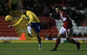 Images Dated 4th February 2014: Tense Showdown: Cyrus Christie vs Marlon Pack in Sky Bet League One Clash