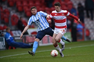 Season 2015-16 Prints: Tommy Rowe vs. Aaron Phillips: Intense Battle in Coventry City's Sky Bet League One Clash at Doncaster Rovers